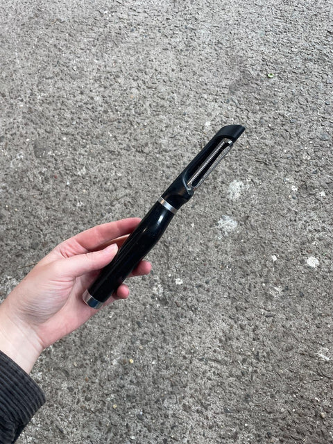Black Handheld Serrated Peeler