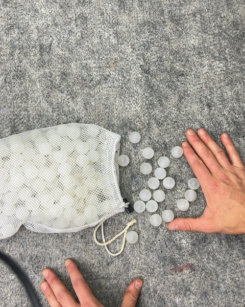 White Plastic Balls in Mesh Bag