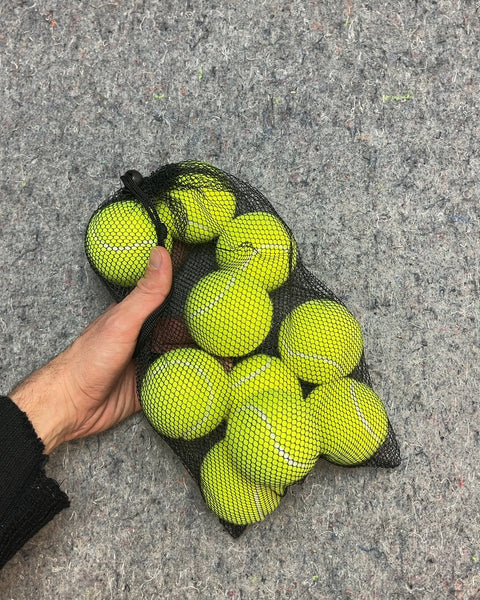 Bunch Of Tennis Balls in Mesh Bag
